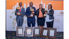 Absa Bank's Sustainability Manager Rufus Mwenda, Risk & Reporting Manager Fred Adungo, Digital Content Manager Joan Misik and Citizenship Manager Antoninah Moturi with the bank's accolades. PHOTO/COURTESY